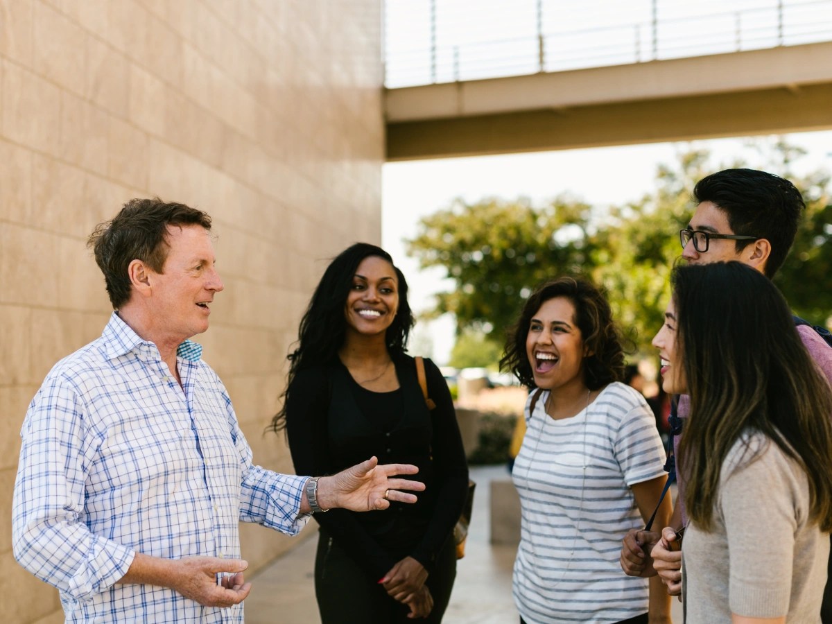 A group of people standing outside