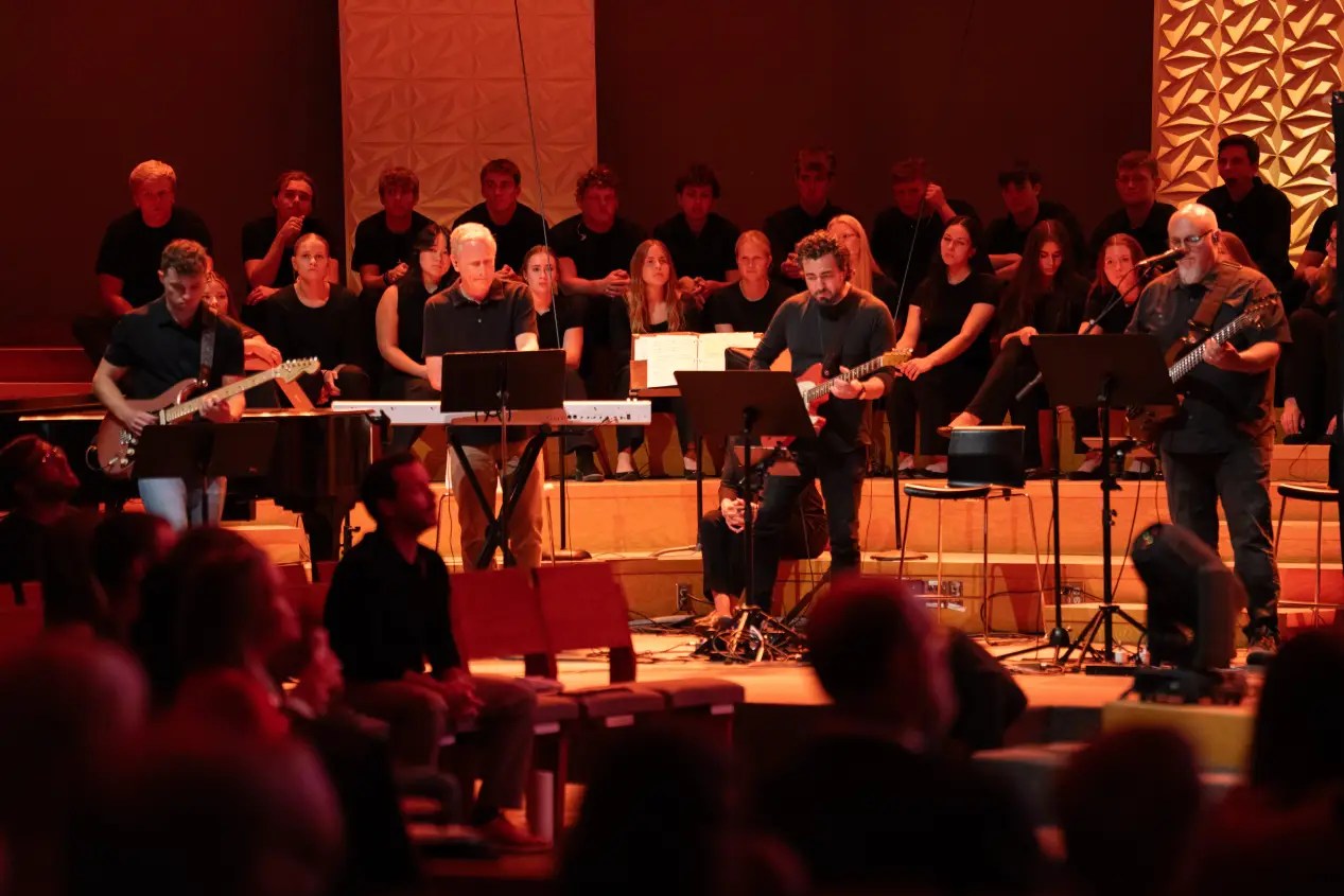 A group of people on a stage playing instruments