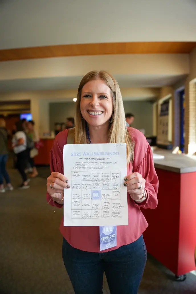 A woman holding a piece of paper