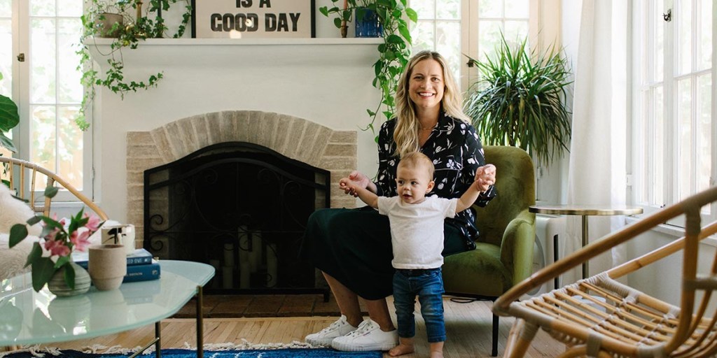 A woman and baby in a living room