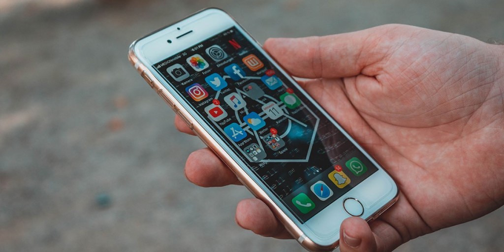 A hand holding a cell phone