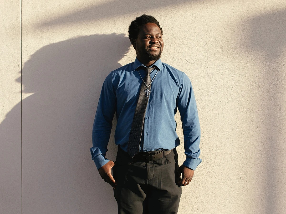 A man standing in front of a wall