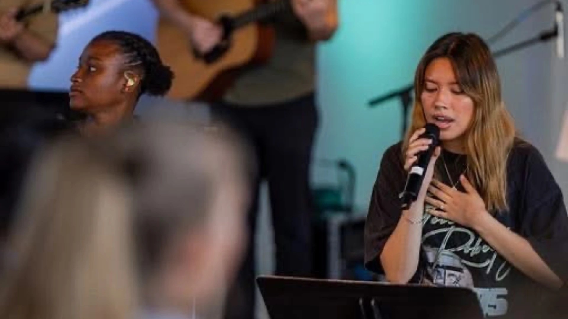 A woman singing into a microphone
