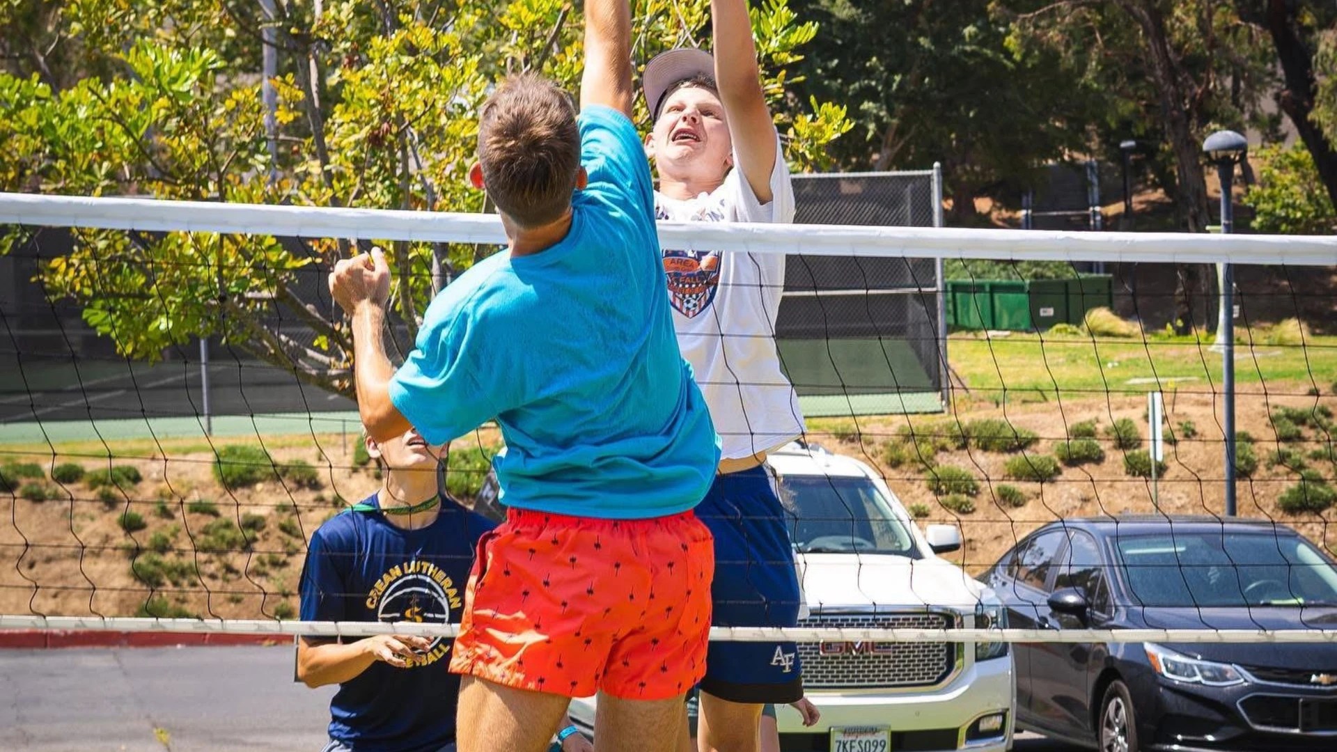 A group of people playing volleyball