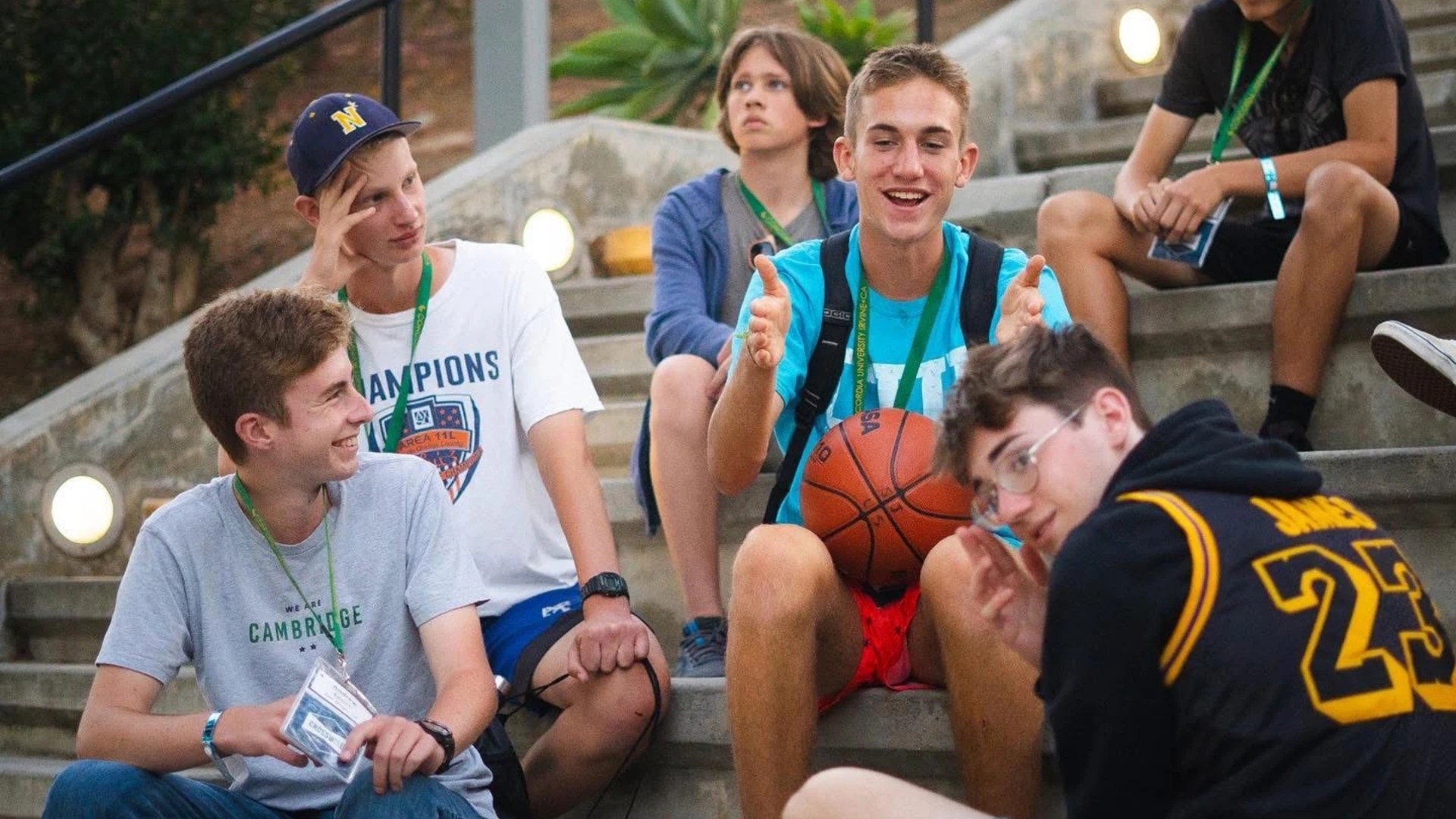 A group of people sitting on stairs