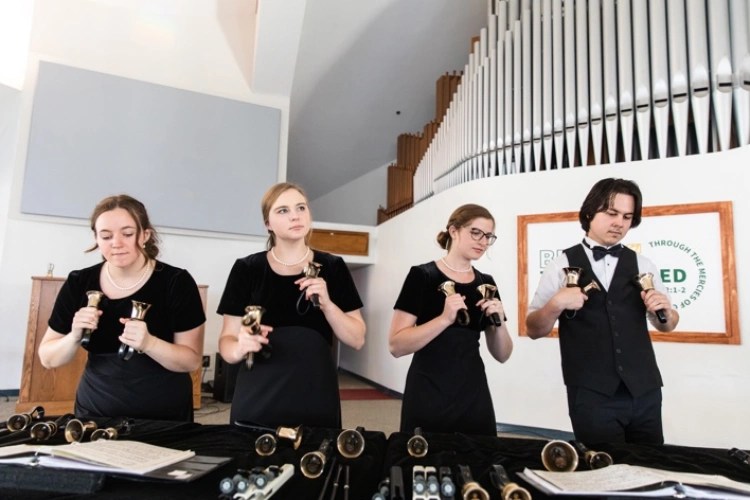 A group of people holding horns