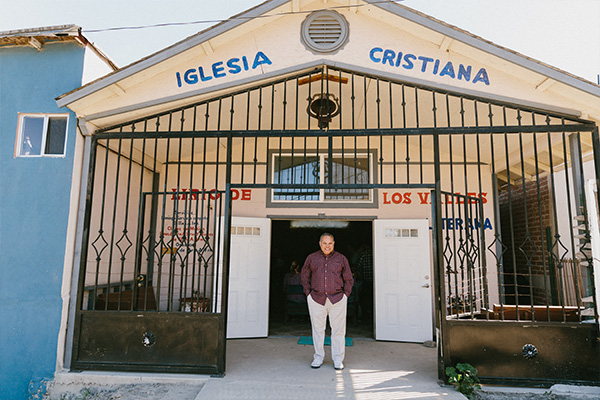 A man standing in front of a building