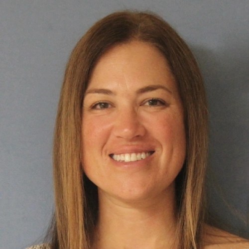 A woman smiling at the camera