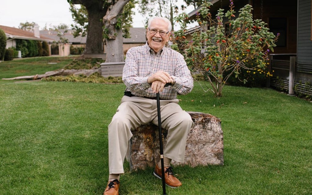 A man sitting on a tree stump