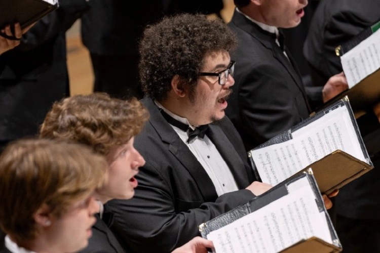 A group of men singing in a choir