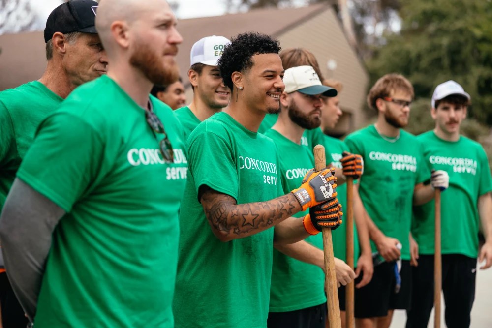 A group of men in green shirts