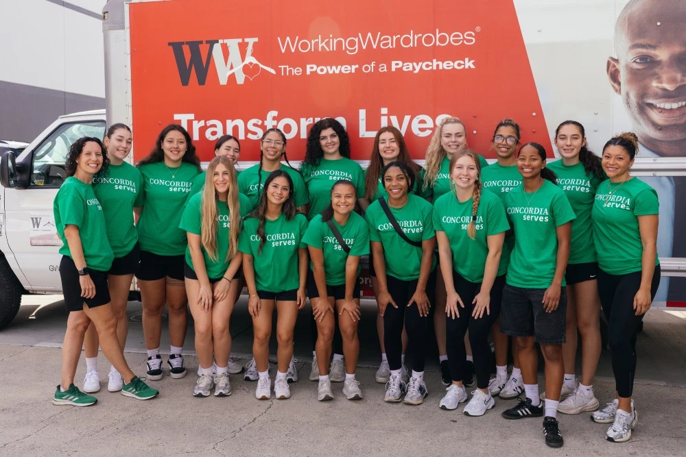 A group of women in matching green shirts