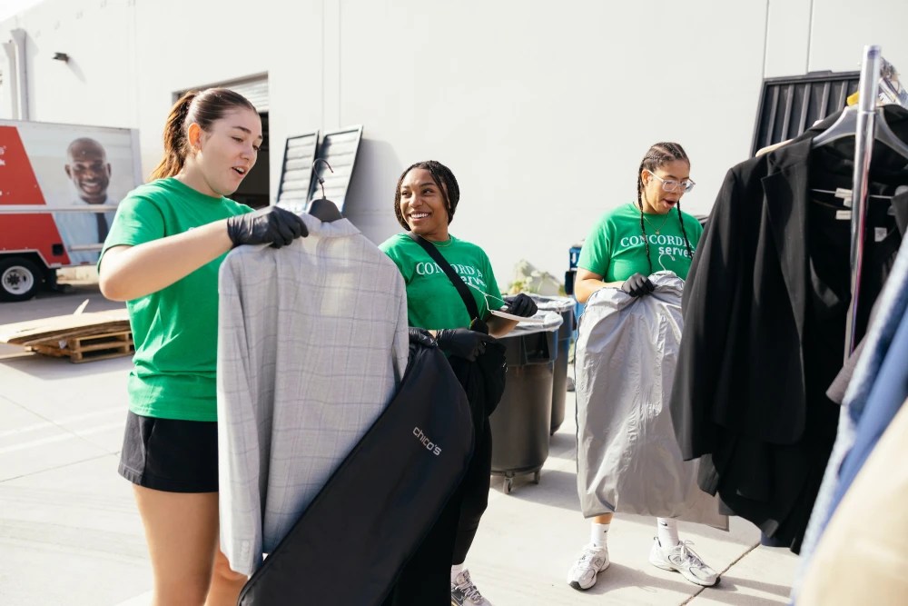 Students review donated suits and garments