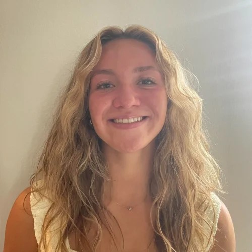 A woman smiling at the camera