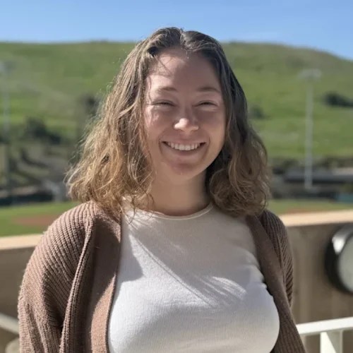 A woman smiling at the camera
