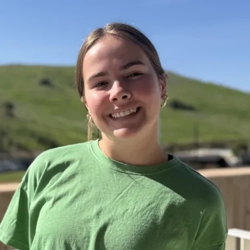 A woman smiling at the camera