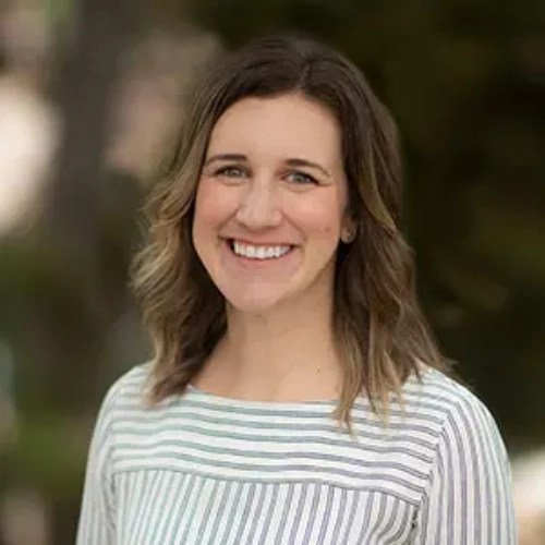 A woman smiling at the camera