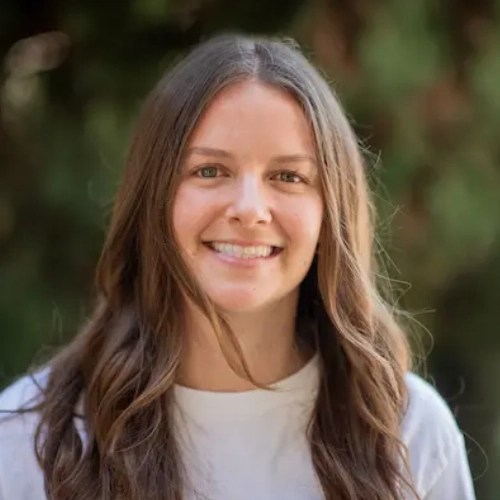 A woman with long hair smiling