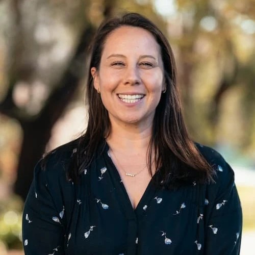 A woman smiling at camera