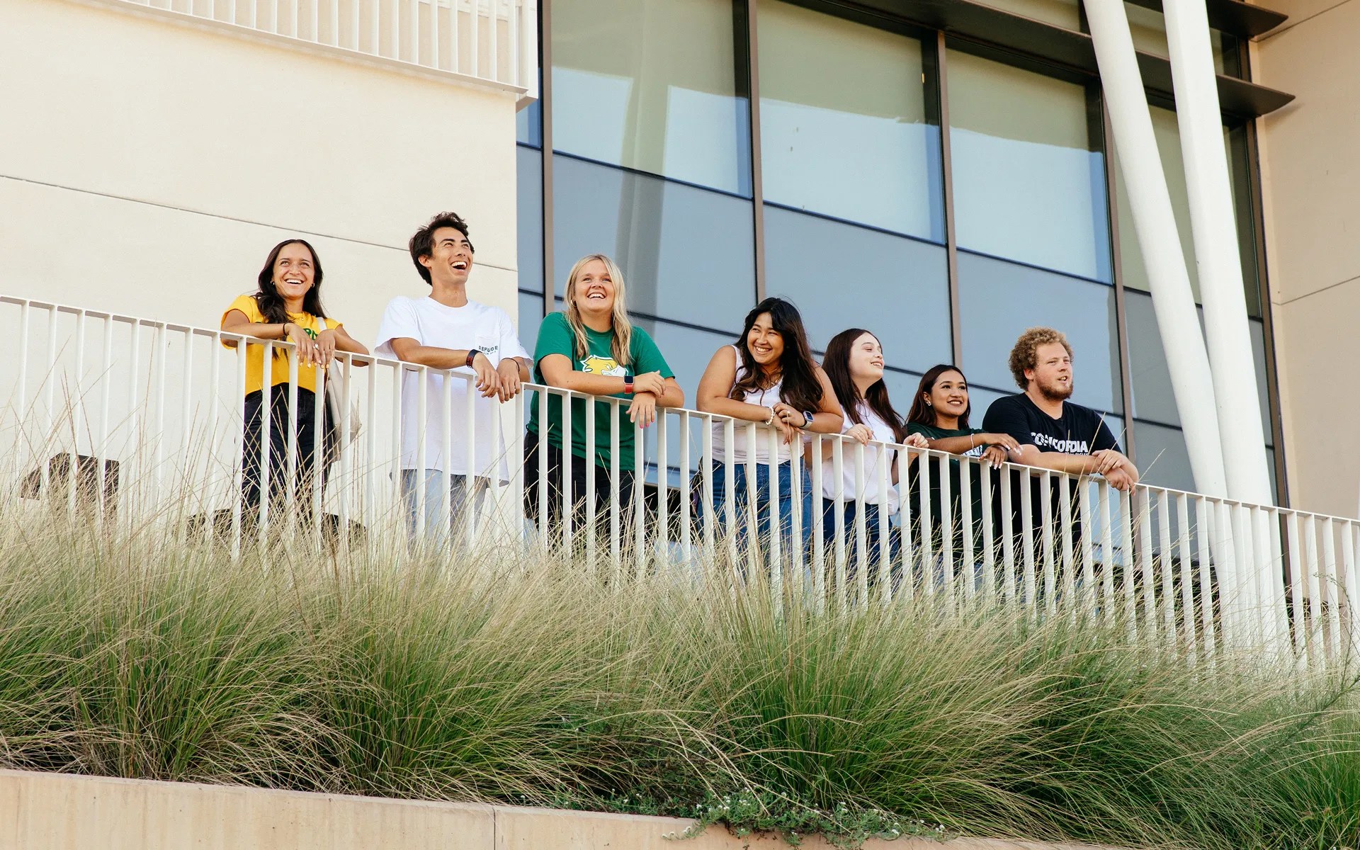 A group of people standing on a balcony