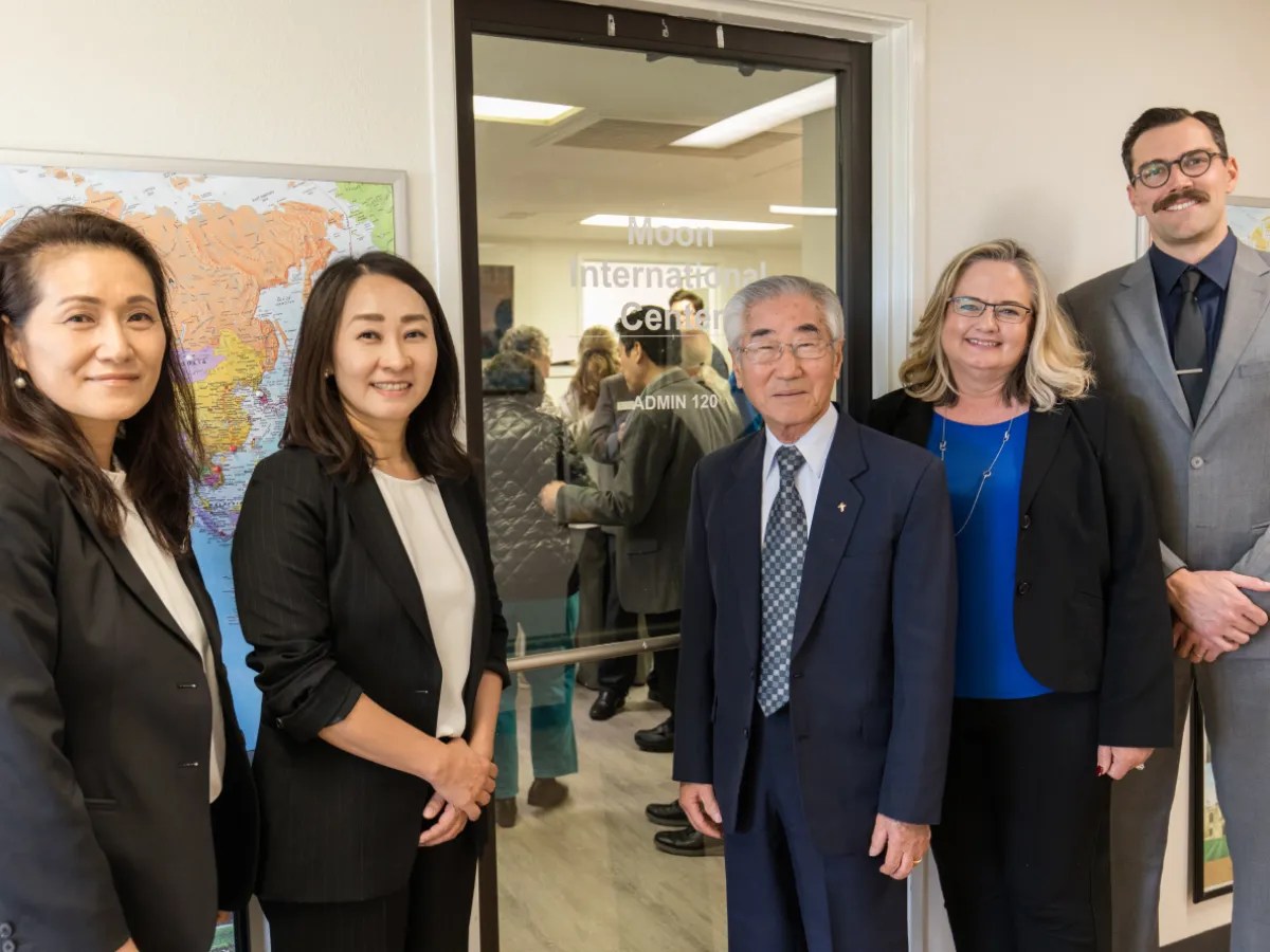 A group of people standing in front of a door