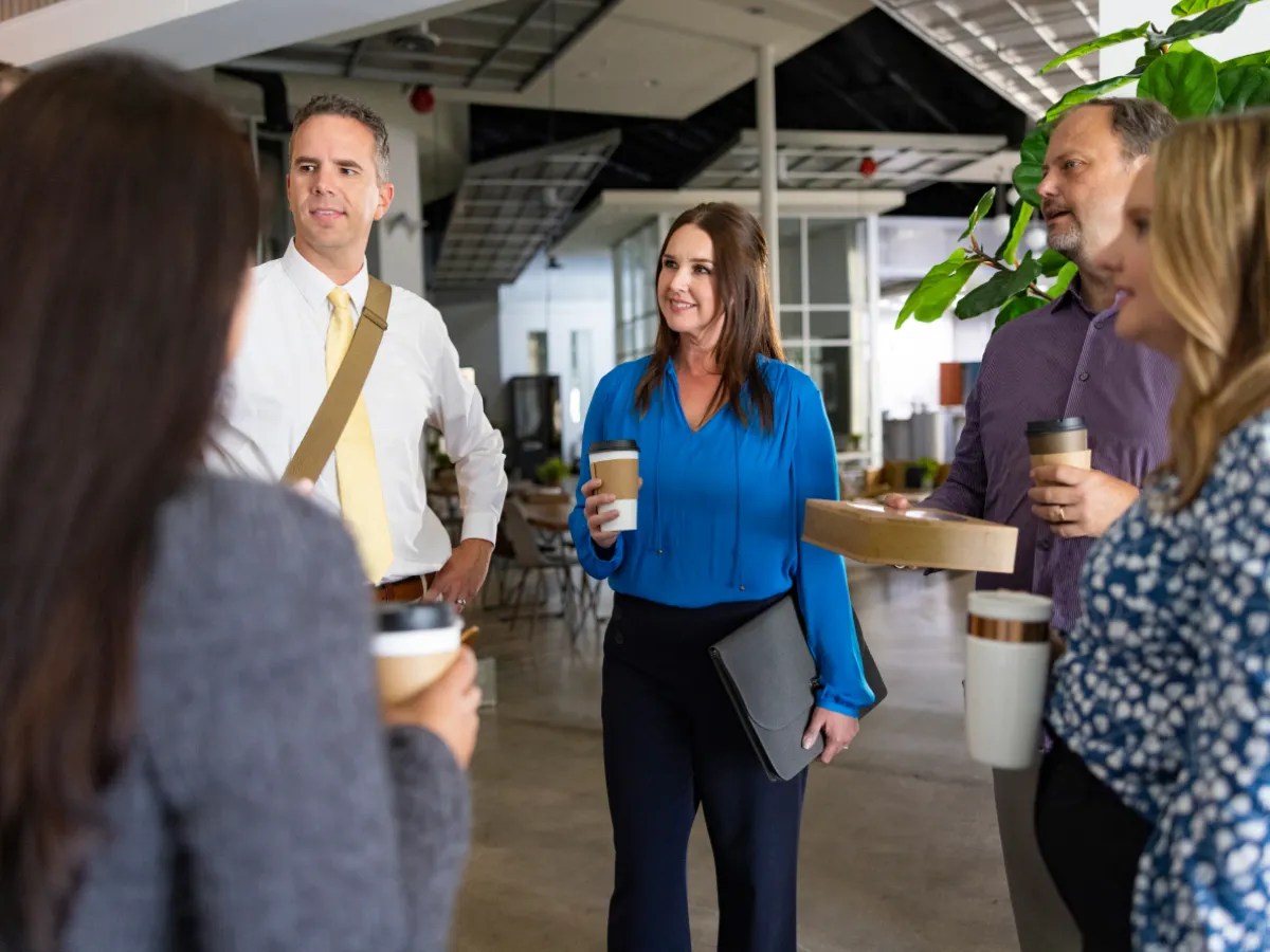 A group of people standing in a room