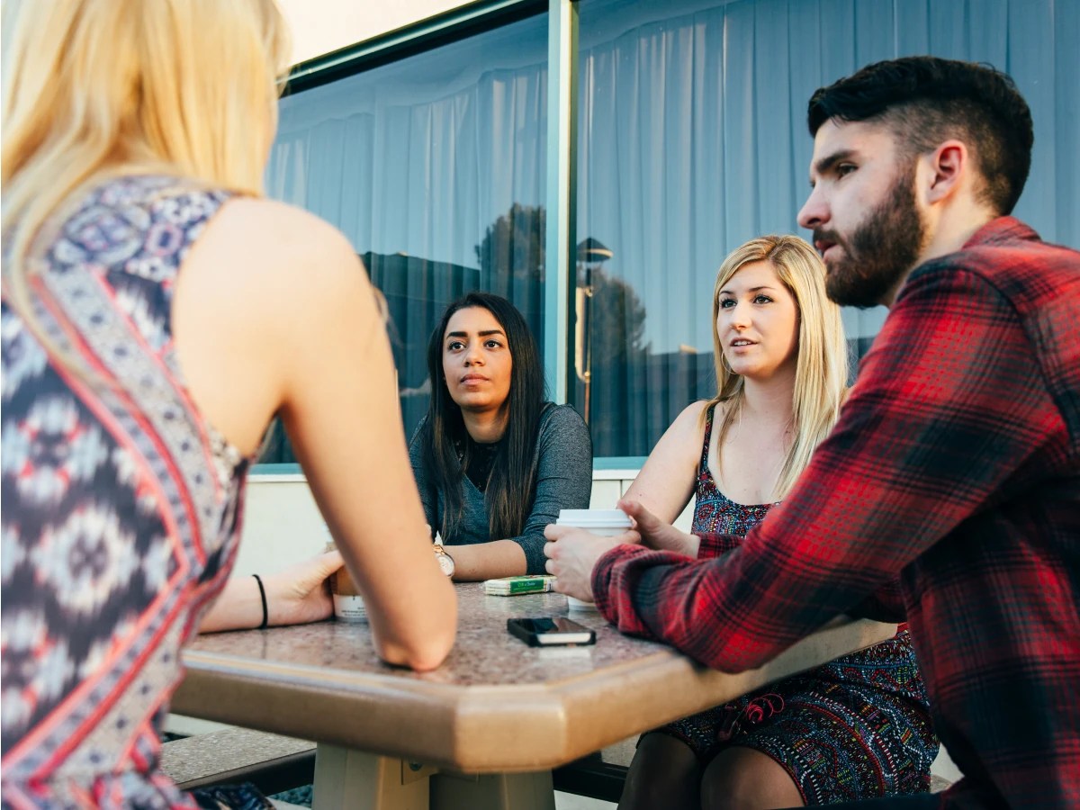A group of people sitting at a table