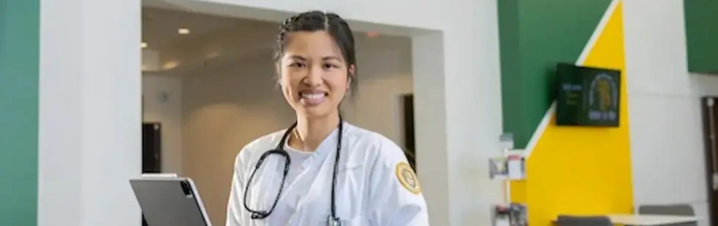A woman in a white coat