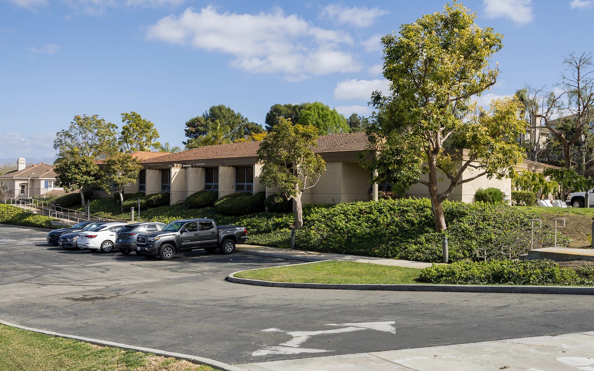 A building with cars parked in front of it