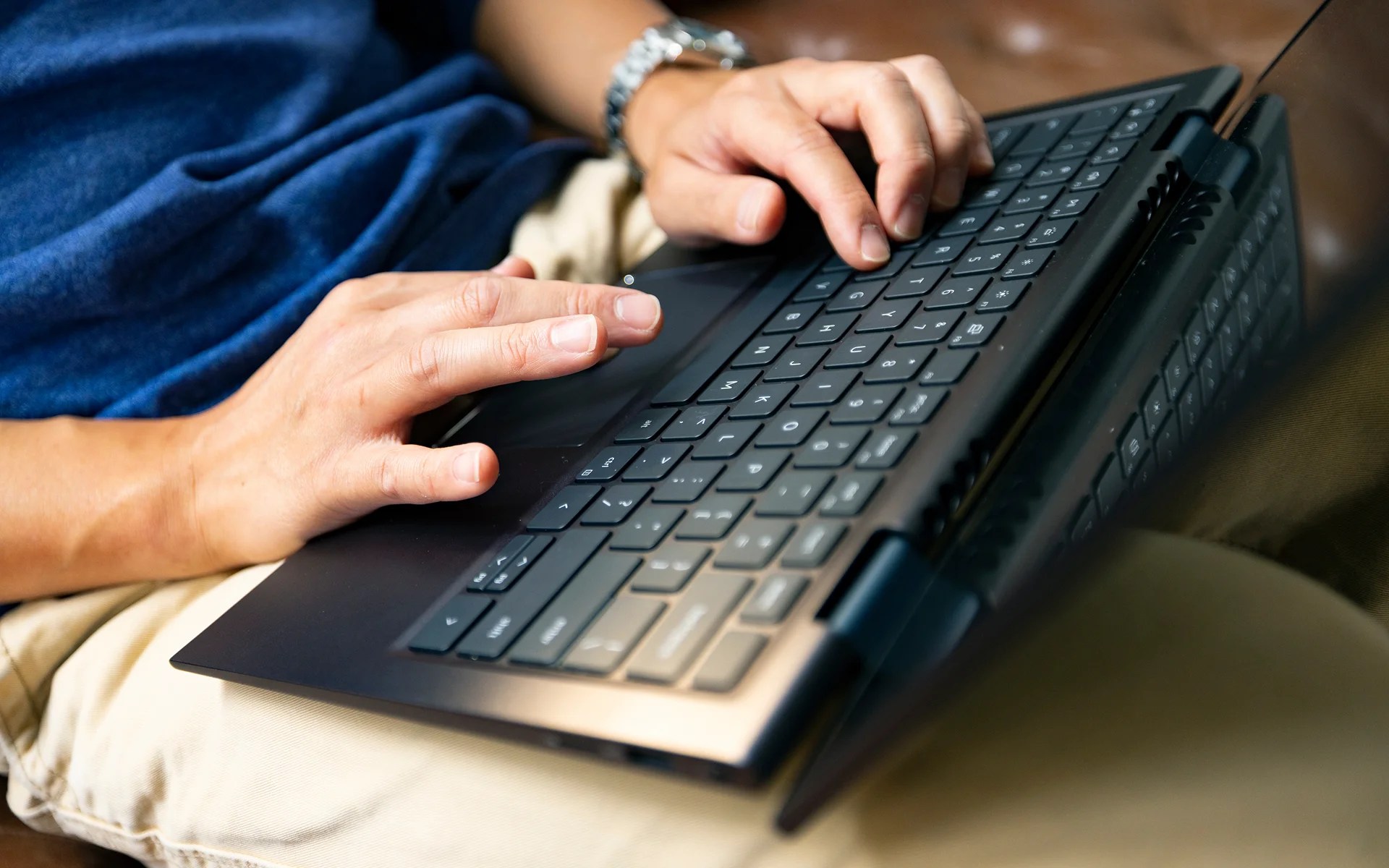 A person typing on a laptop