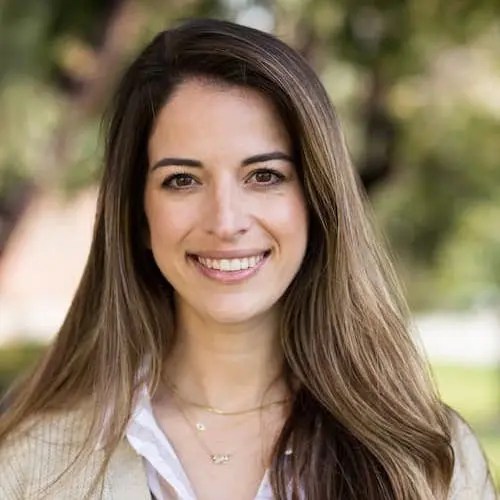 A woman smiling at the camera