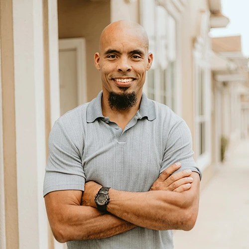 A man standing with his arms crossed