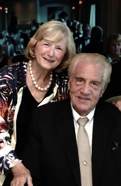 A man and woman posing for a picture