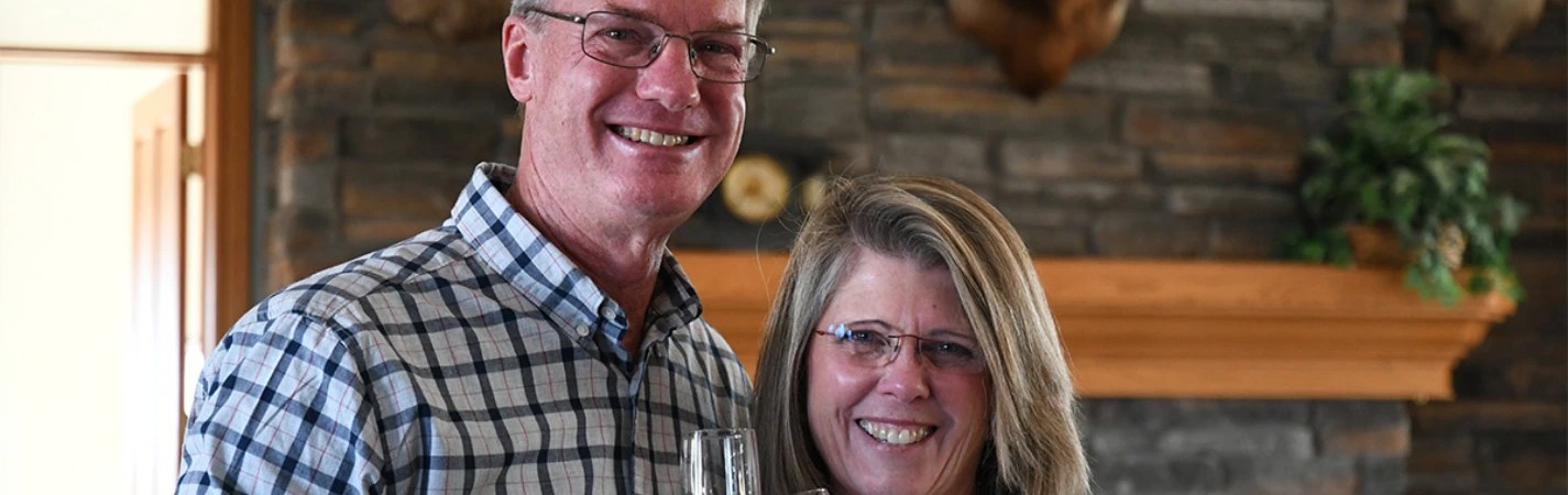 A man and woman smiling for a picture