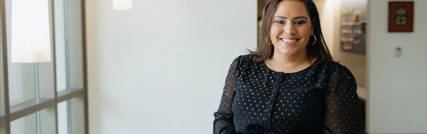 A woman smiling at the camera