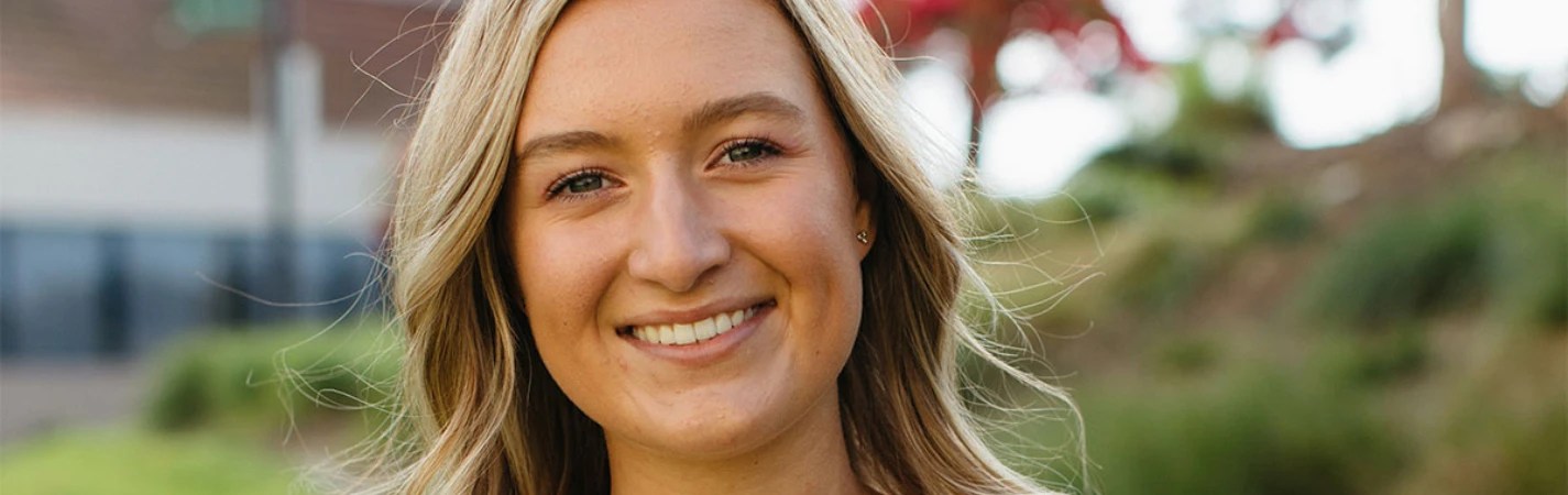 A close-up of a woman smiling