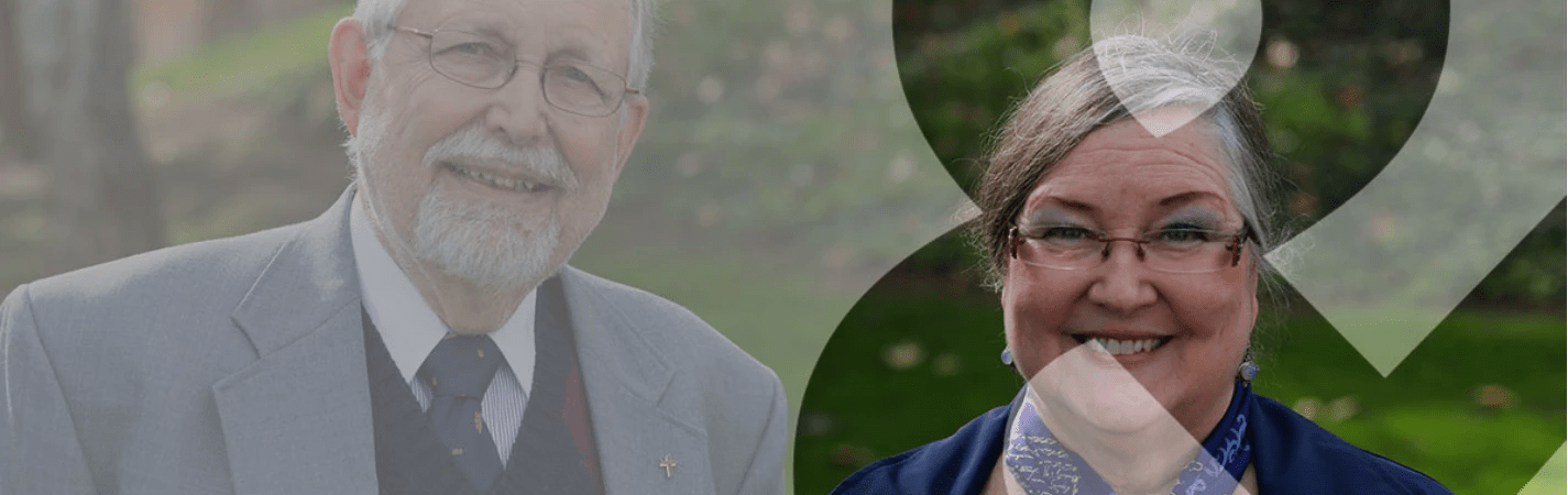 A man and woman smiling