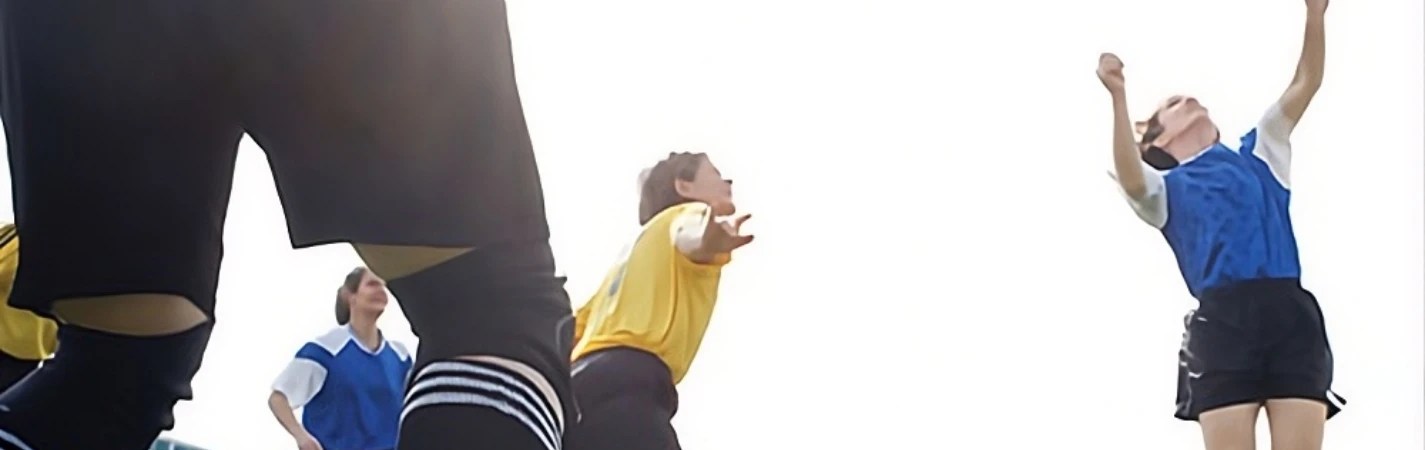 A person reaching out to catch a frisbee