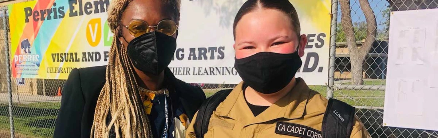 A couple of people wearing face masks