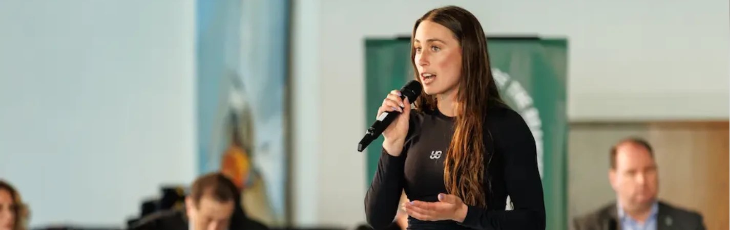 A woman speaking into a microphone