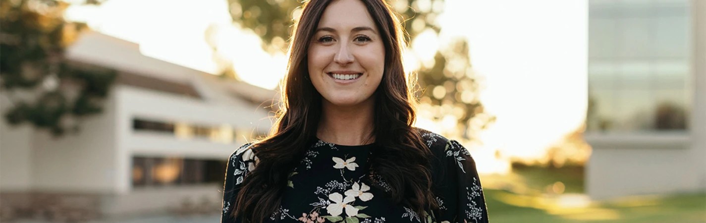 A woman smiling at the camera