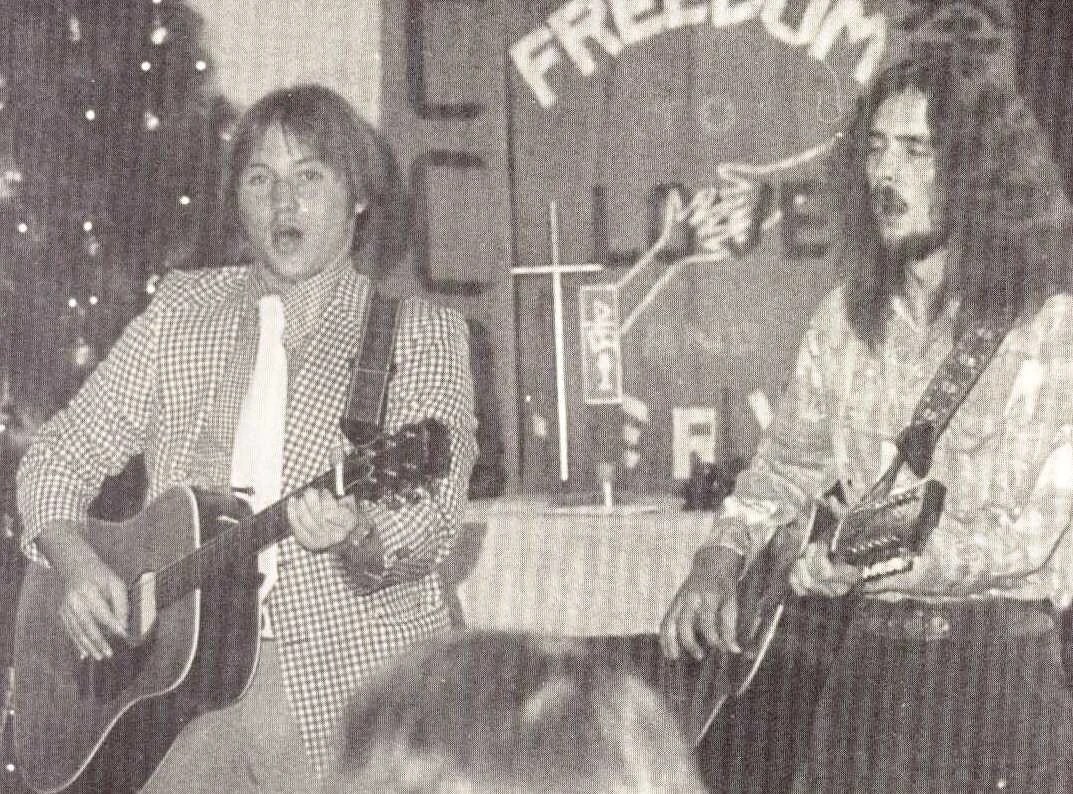 A group of men playing guitars