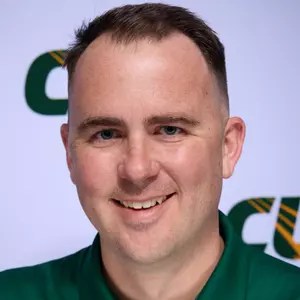 A man in a green shirt