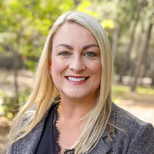 A woman smiling for a picture