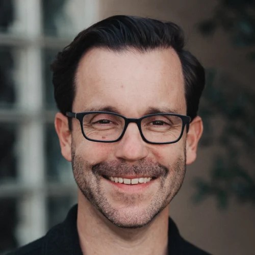 A man smiling at the camera