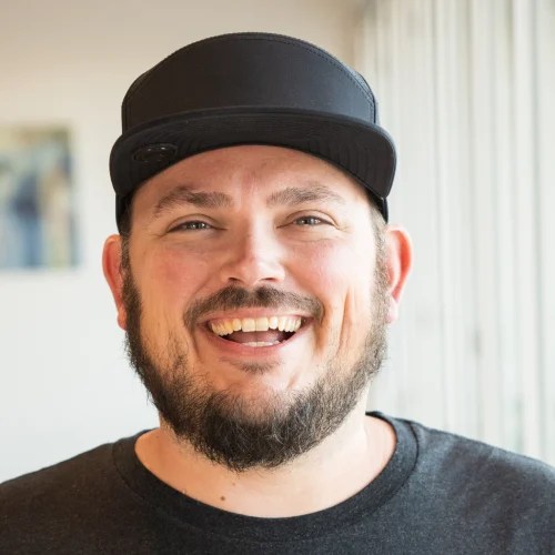 A man wearing a black hat
