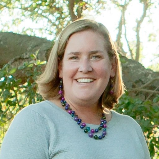 A woman smiling for the camera