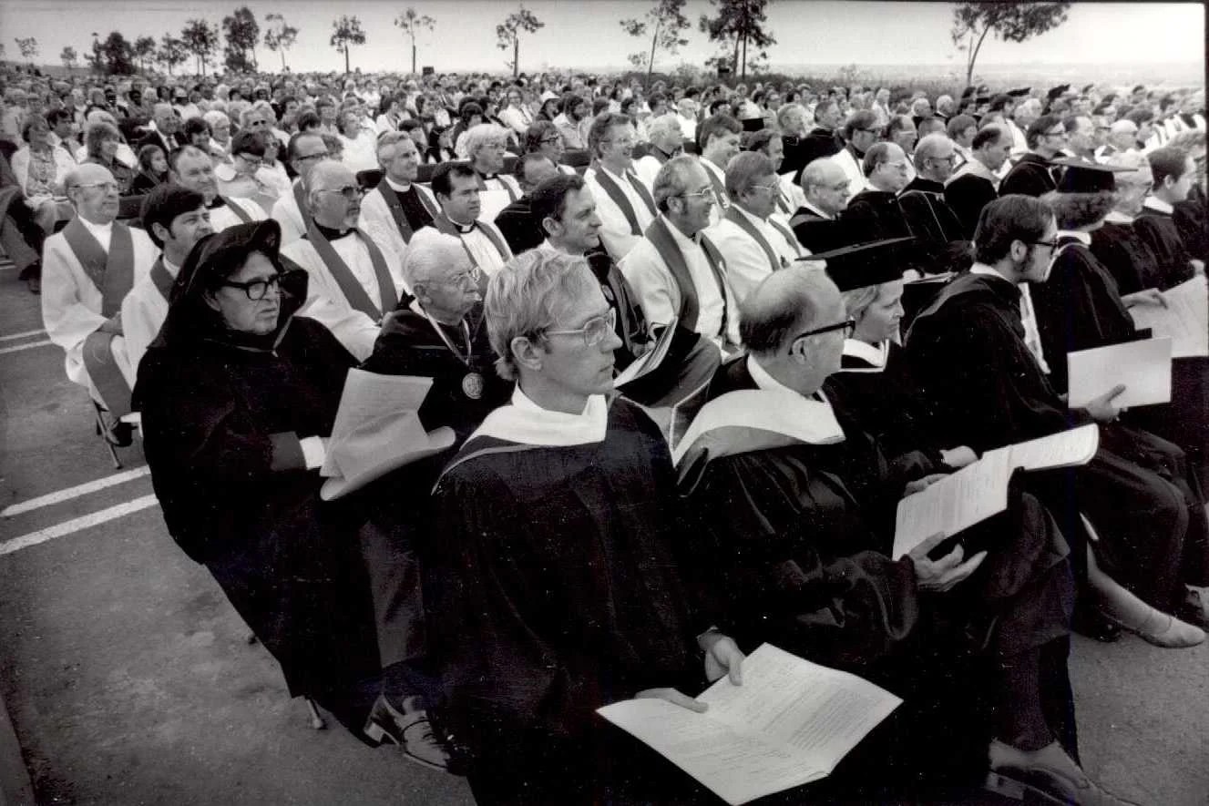 A group of people sitting in a row