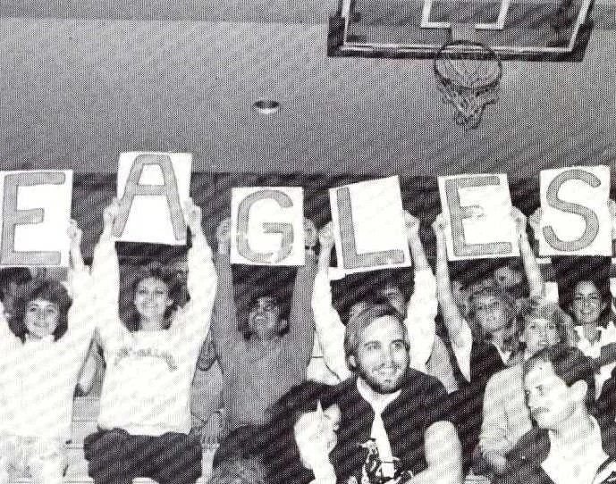 A group of people holding up letters