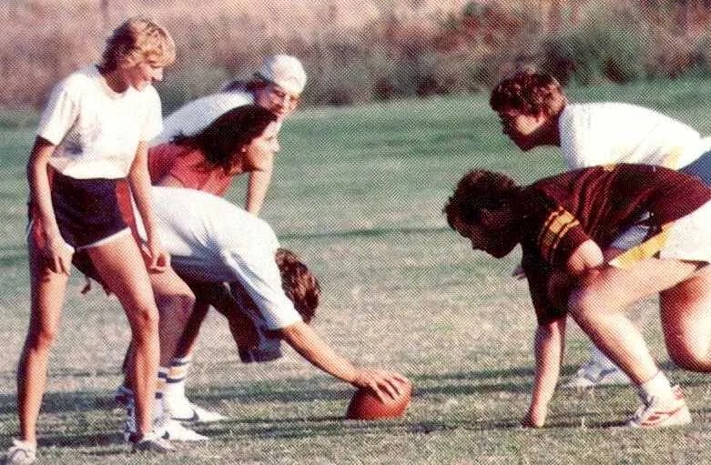 A group of people playing football